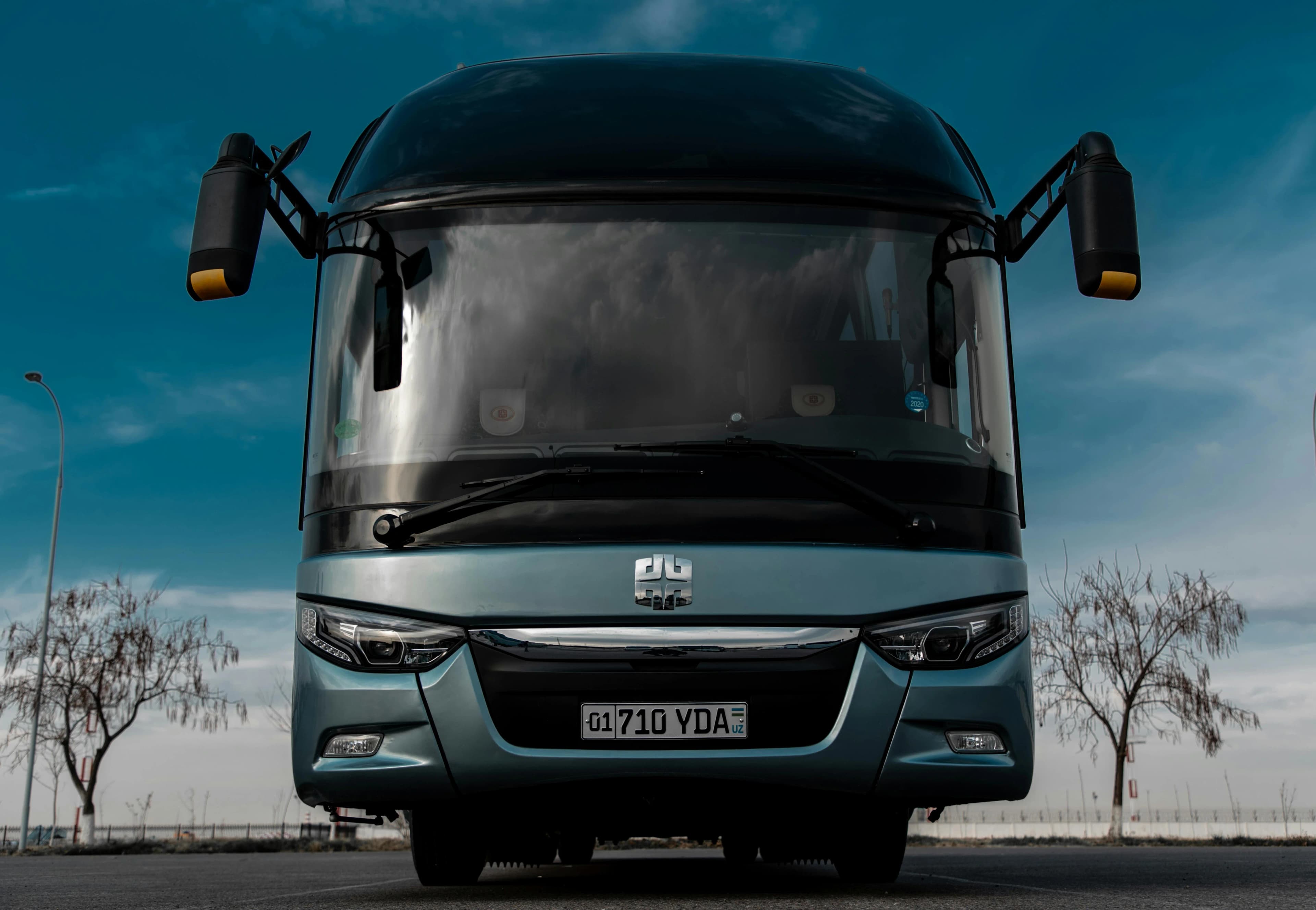 VIP coach interior — passengers settled, ready to depart